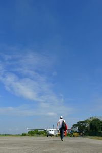 Full length of woman standing against clear sky