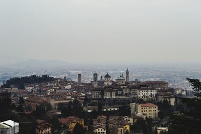 High angle view of buildings in city against clear sky