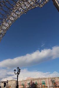 Low angle view of buildings in city against sky