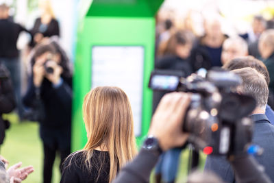 Filming media event with a video camera