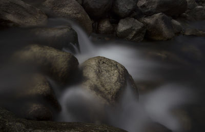 Close-up of water flowing through rocks