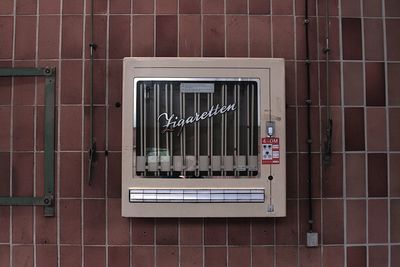 Text on glass window of building