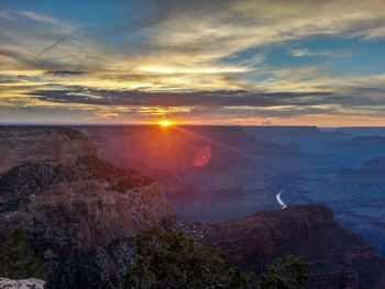 Scenic view of landscape against sky during sunset