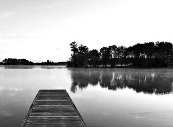 Reflection of trees in calm lake