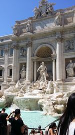 Statue in front of historical building