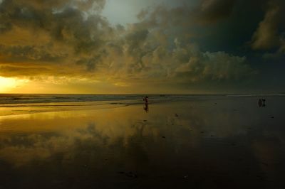 Scenic view of sea against cloudy sky