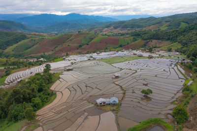 High angle view of agricultural field and mountains
