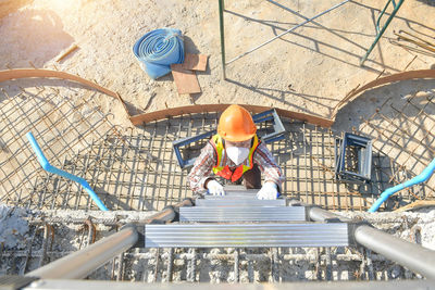 High angle view of man photographing at construction site