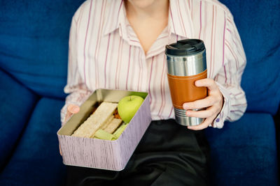 Meal delivery services, express office food lunch delivery. young smiling business woman working at