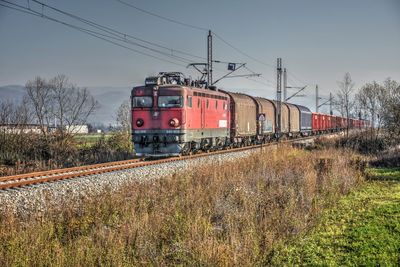 Train on railroad track against sky