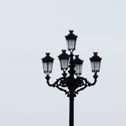 Low angle view of street light against clear sky