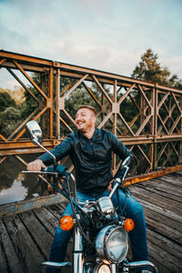Portrait of smiling man riding motorcycle