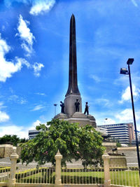 Low angle view of tower against cloudy sky