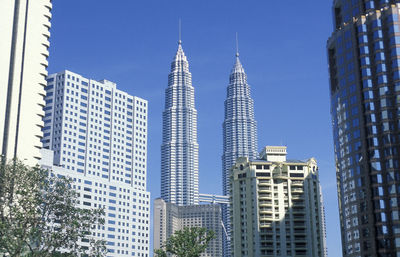 Low angle view of buildings against blue sky