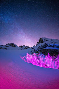 Light painting on snow covered land at night