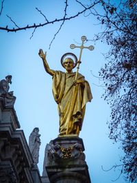 Low angle view of statue against sky