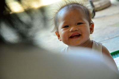 Close-up portrait of smiling baby girl