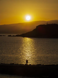 Romantic summer sunset, in backlight on the calabrian sea, with the promontory in the background