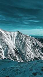 Scenic view of sea against sky during winter