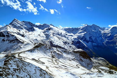 Scenic view of snowcapped mountains against sky