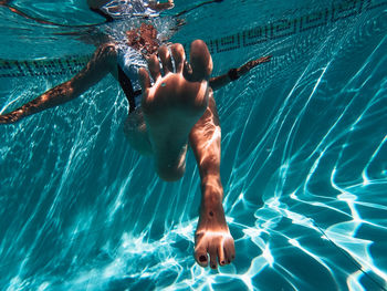 Man swimming in pool