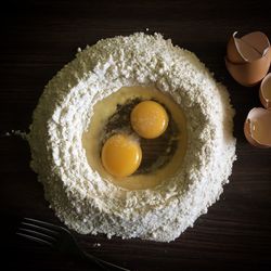 Close-up of flour and eggs