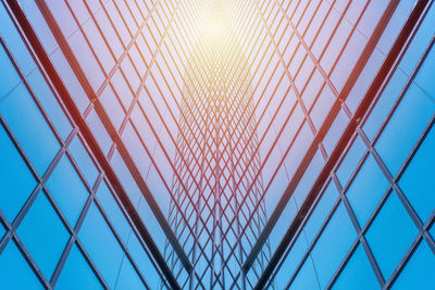 Low angle view of glass ceiling against sky