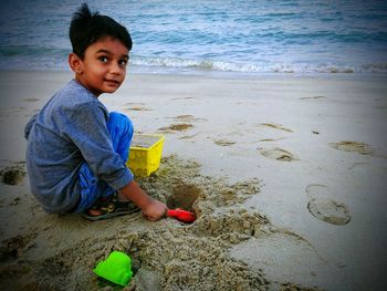 Cute boy playing at beach