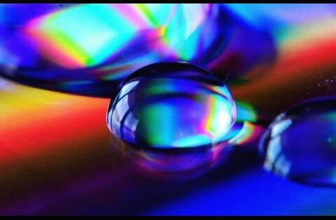 indoors, multi colored, close-up, illuminated, glass - material, transparent, blue, colorful, focus on foreground, lighting equipment, selective focus, still life, abstract, glowing, shiny, reflection, no people, sphere, pattern, light - natural phenomenon