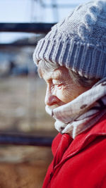 Side view of senior woman wearing knit hat