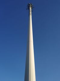 Low angle view of tower against blue sky