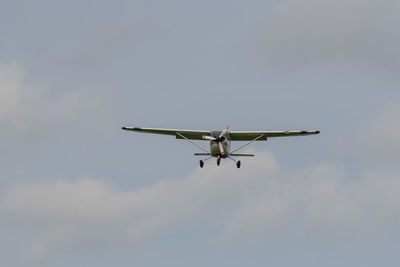 Low angle view of airplane in sky