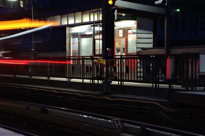 Train at railroad station at night