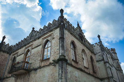 Low angle view of old building against sky