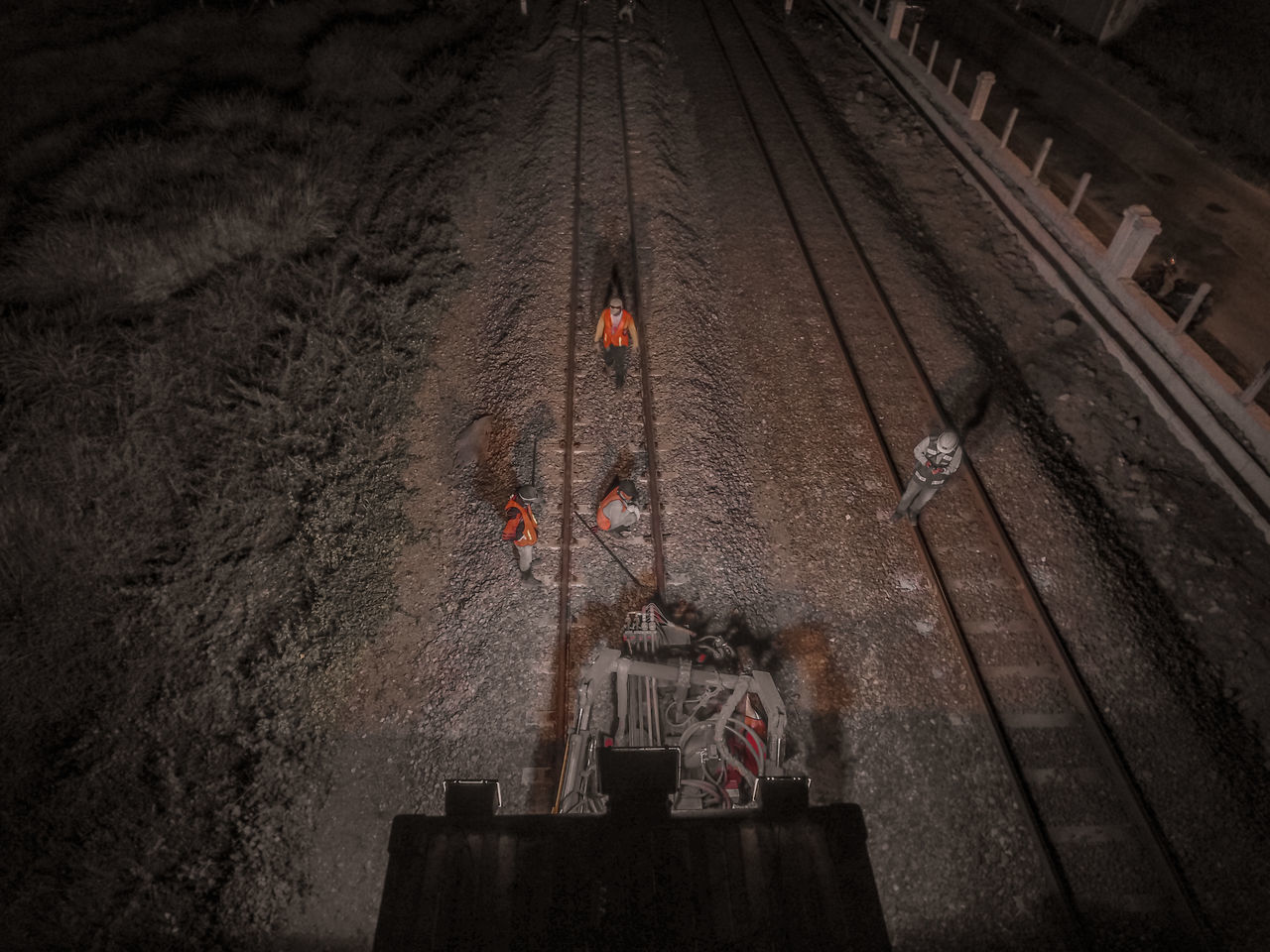 HIGH ANGLE VIEW OF RAILROAD TRACKS BY WATER