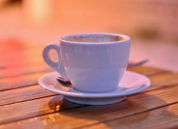 Close-up of coffee cup on table