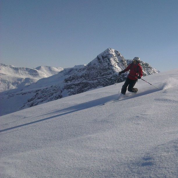 snow, mountain, winter, leisure activity, cold temperature, lifestyles, full length, adventure, men, clear sky, season, mountain range, extreme sports, landscape, hiking, rear view, travel, unrecognizable person