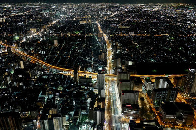 High angle view of illuminated cityscape at night