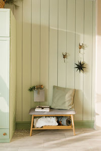 Cozy christmas interior of the house with a wooden bench and a mailbox for santa claus letters