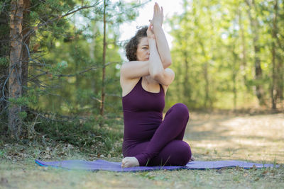 Young woman exercising in park