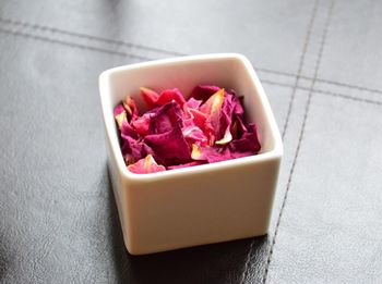 High angle view of rose petals in container