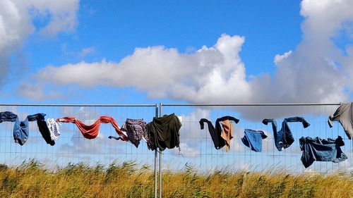 Clothes drying against sky