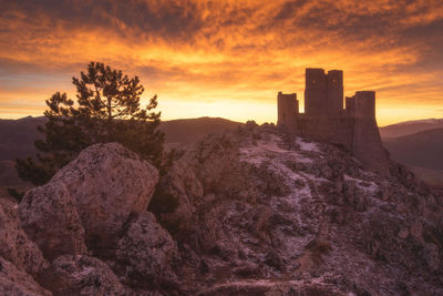 Castle against sky during sunset