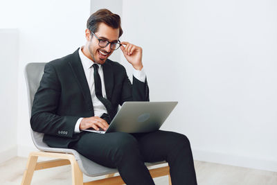 Businesswoman using laptop at home