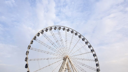 Low angle view of ferris wheel against sky