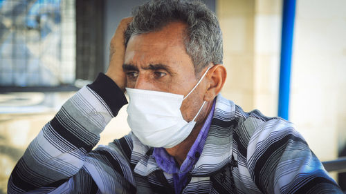 Portrait of man wearing mask