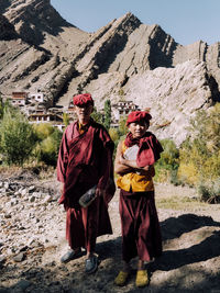 Full length of a man standing on rock