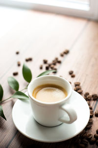 High angle view of coffee cup on table