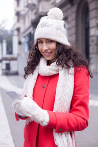 Portrait of young woman wearing hat