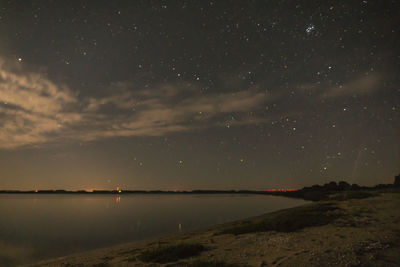 Scenic view of sea against sky at night